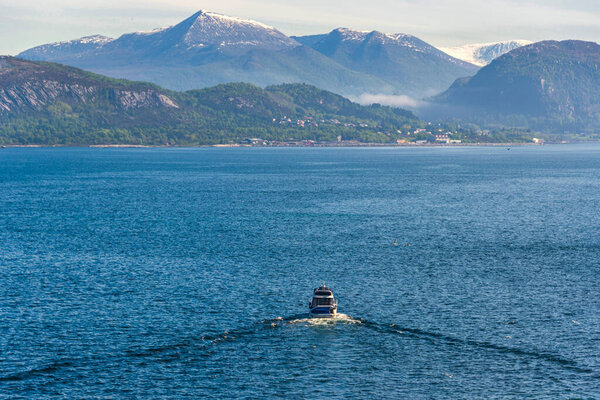 floating boat on water surface, lake in mountains 