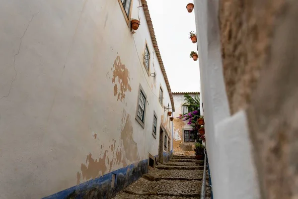 Lisbon, Portugal: The beautiful little village of Obidos in the central Portugal during the national medieval day. Wooden art craft of Mercado (in english: Market) in the heart of the village