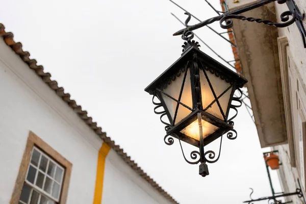 Lisbon, Portugal: The beautiful little village of Obidos in the central Portugal during the national medieval day. Wooden art craft of Mercado (in english: Market) in the heart of the village