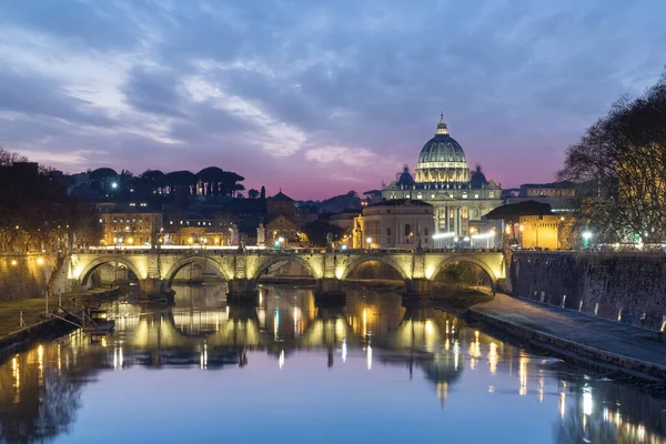 The Vatican city, the Saint Peter Cathedral in Rome city center with the Ponte Umberto I and the castle of Sant\' Angelo at sunset. Beautiful dramatic sunset over the sky in Rome, motion water photo