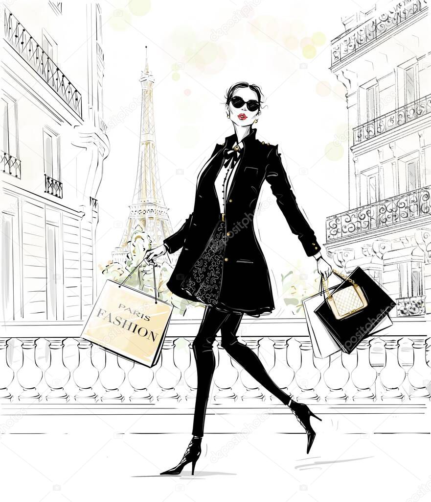 Hand drawn beautiful young woman with bags. Fashion look. Stylish girl in fashion clothes with Paris street background. Woman in black coat. Sketch. Fashion illustration.