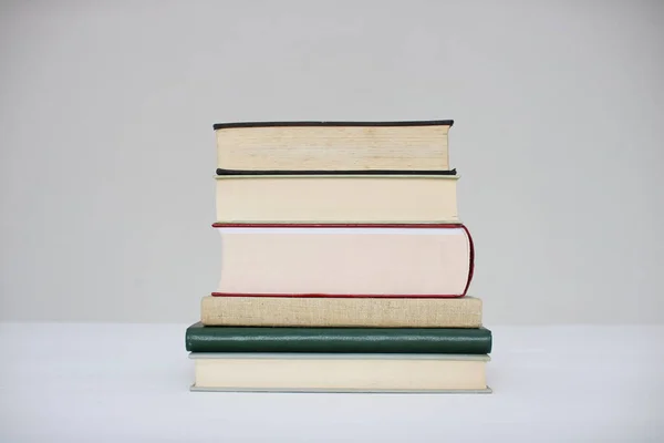 Stack of books on white background