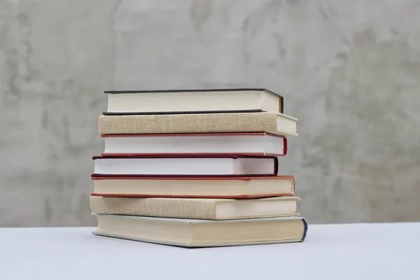 stock image Stack of books on gray background