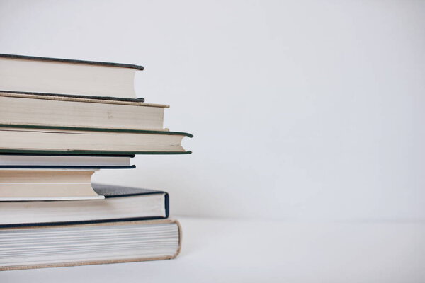 Stack of books on white background