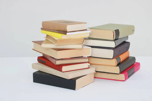 Stack of books on white background