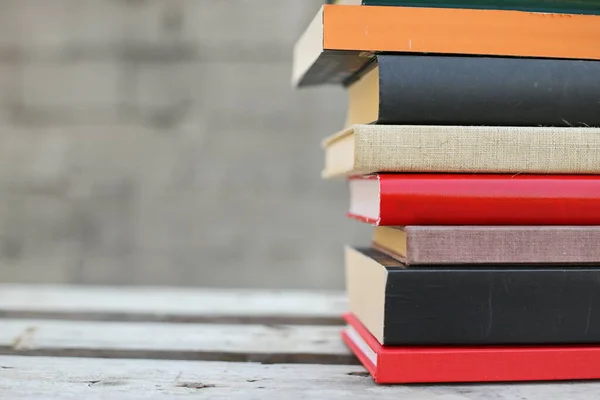 Books on a wooden box, books in an industrial setting