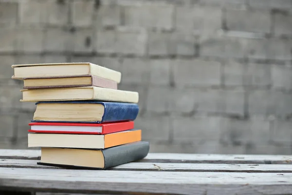 Books on a wooden box, books in an industrial setting