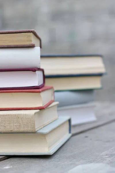 Stack of books on a wooden box