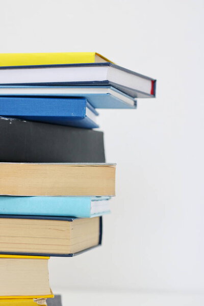 Stack of books on white background