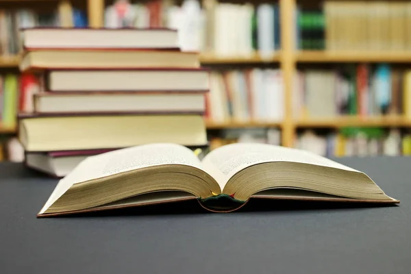 An open book on a black background in the library