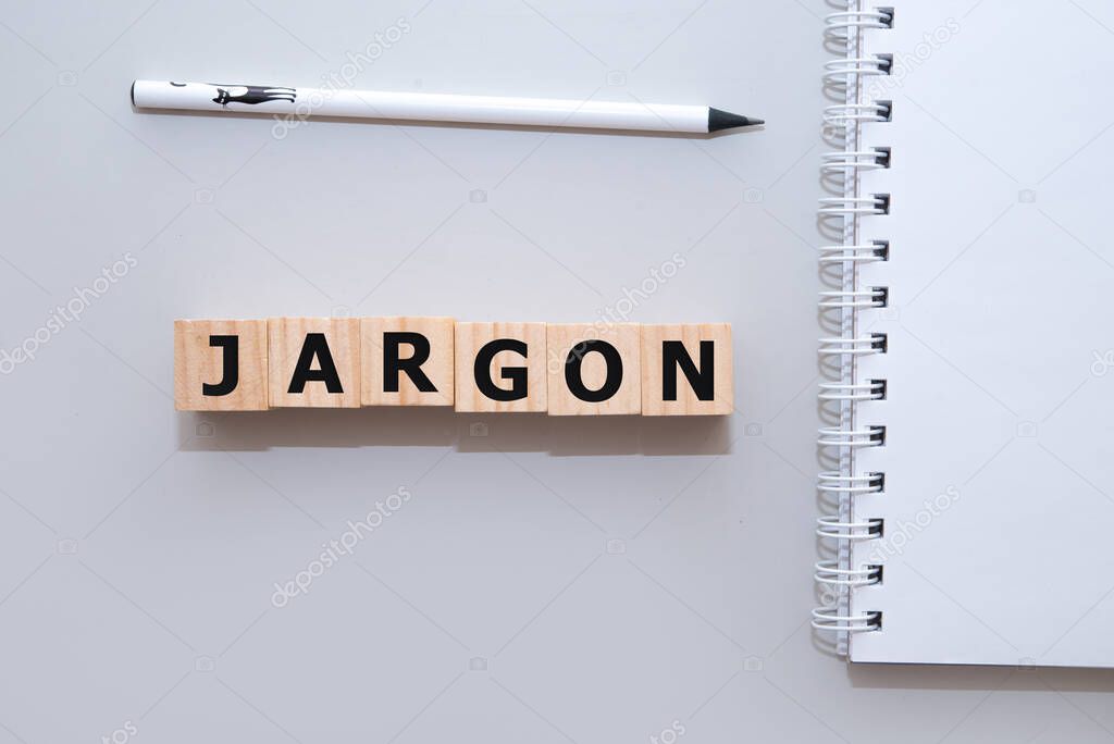 Jargon - word from wooden blocks with letters, special words and phrases jargon concept, top view on white background.