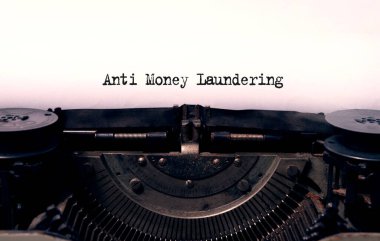 anti money laundering typed words on a vintage typewriter clipart