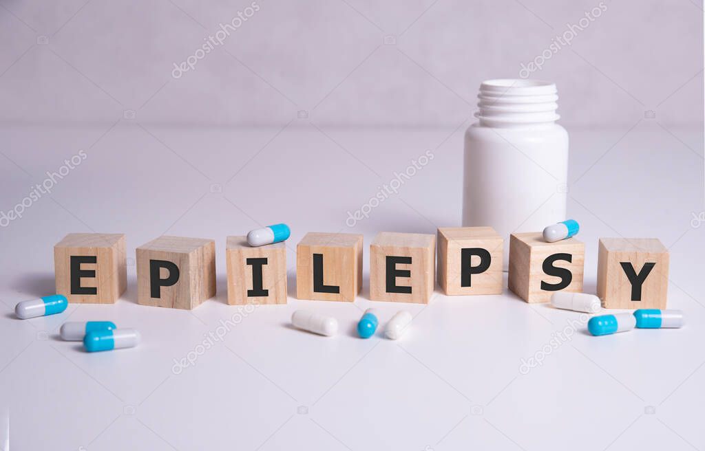 EPILEPSY word on wooden cubes, background. Concept of epilepsy awareness