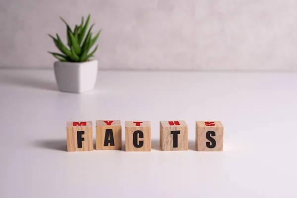 Facts and myths words on wood blocks on white. — Stock Photo, Image