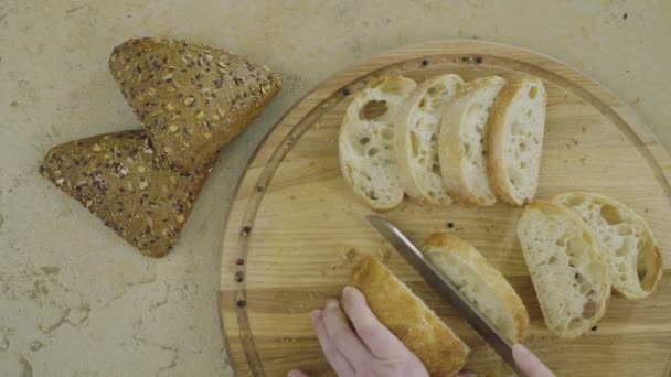 Woman Cuts White Fresh Bread — Stock Video