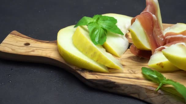 Sliced Prosciutto Melon Wooden Board — Stock Video