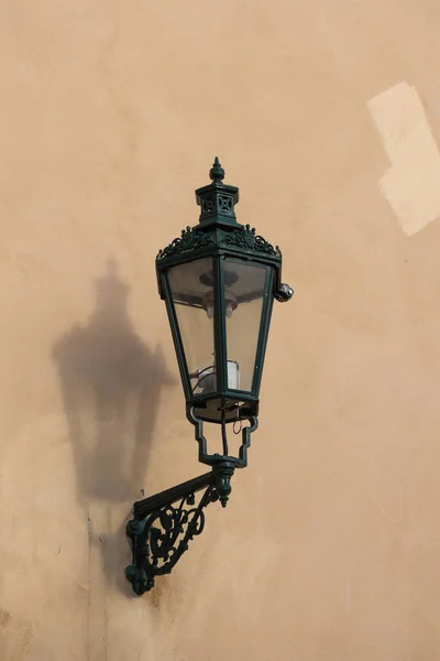 Facade of a building with a stylish retro styled street lamp - lantern. Old city of Prague, Czech republic.
