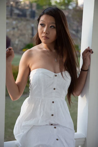 Pretty Asian Woman Sitting Outdoors — Stock Photo, Image