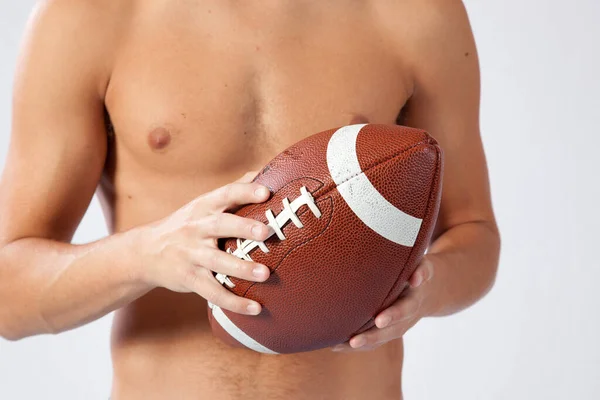 Shirtless Man Holding American Football — Stock Photo, Image