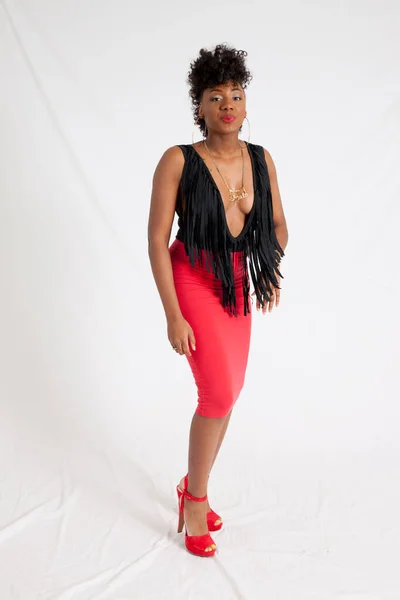 Sexy black woman in a black fringe vest