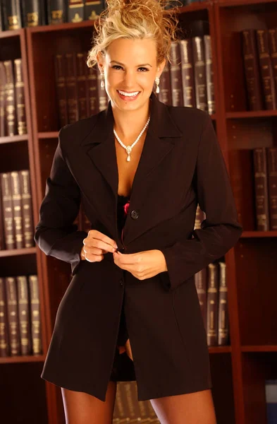 Conservative Traditional Sharp Business Suit with Stockings Job Interview Corporate Ladder Outfit - Tear drop pearl necklace and earrings - Dark Copy Space - Adorable Face - Legal Law Book Library  Indoor studio - tantalizing exciting appealing