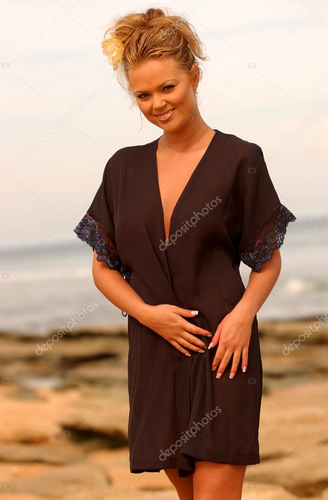 Happy Stunning blonde posing in cute black purple satin robe on Daytona Beach ocean - blue sea water - natural look of a real beauty - Sunshine sun tan sun drenched sunny healthy attitude of a carefree babe on a sunny day golden light sunrise sunset