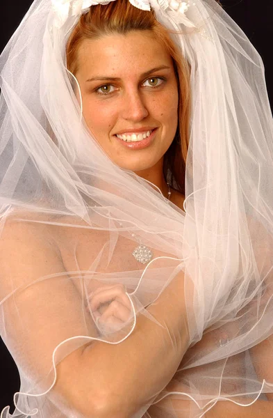White wedding veil on cute brunette