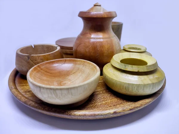 Traditional wooden craft jars for spices. Isolate on a white background.