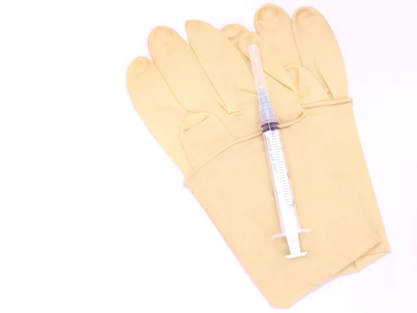 Pair Surgical Medical Gloves Plastic Syringe Cap White Background — Stock Photo, Image