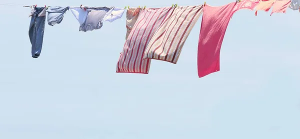 Drying clothes on a clothesline.