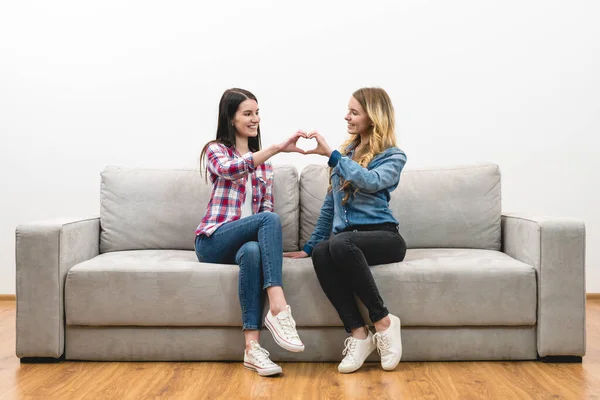 Two Women Show Heart Symbol White Wall Background — Stock Photo, Image