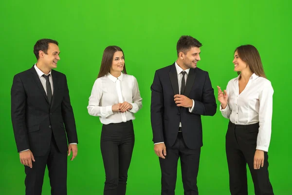Four Business People Talk Green Background — Stock Photo, Image