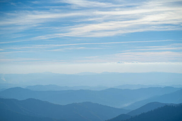 The picturesque foggy mountain landscape