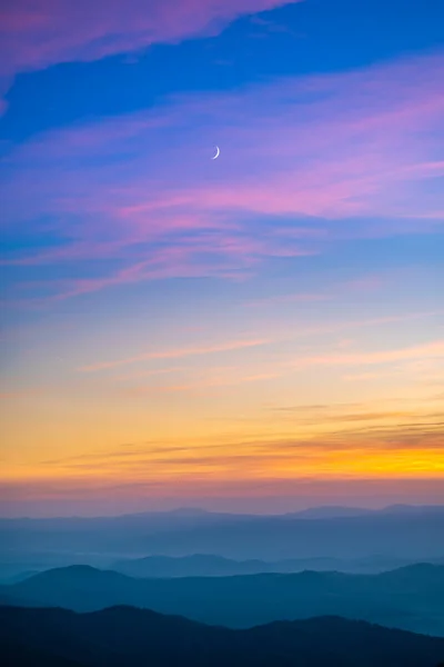 The picturesque mountain landscape on the sunrise background
