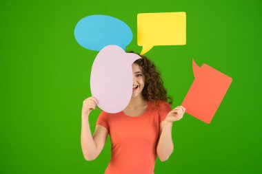 The woman with dialog signs on the green background