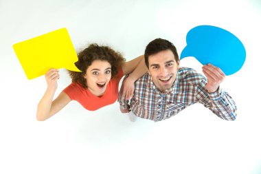 The happy couple stand with dialog signs. View from above