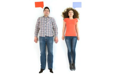 The happy couple lay near the dialog signs. View from above