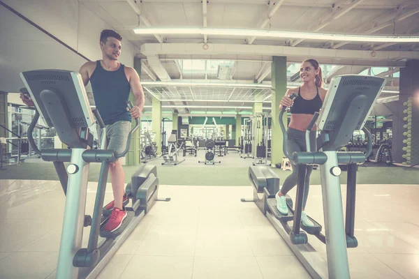 Sport Couple Doing Exercise Cardio Apparatus — Stock Photo, Image