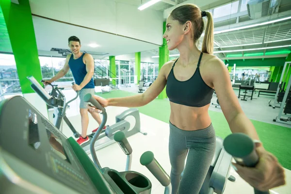 Sport Couple Doing Exercise Cardio Apparatus — Stock Photo, Image