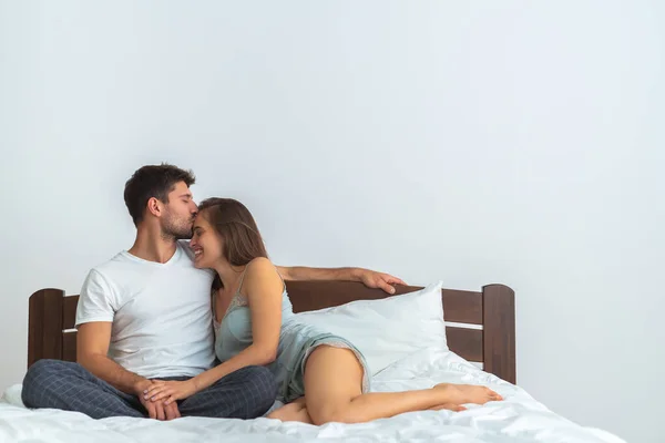 Happy Man Woman Kissing Bed White Background — Stock Photo, Image