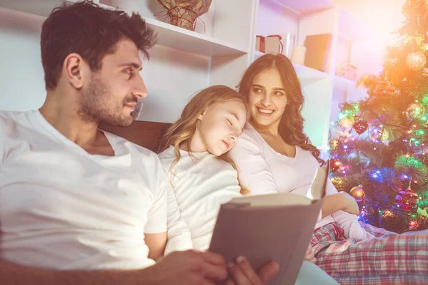 Sleepy Family Lay Read Book Christmas Tree Evening Time — Stock Photo, Image