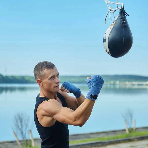 a boxer does training sessions in the morning on the sports field