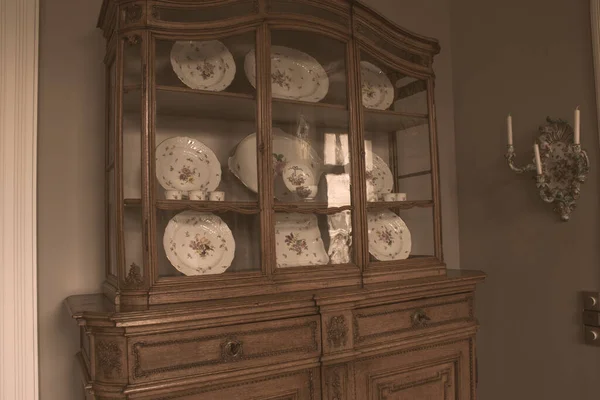 Old vintage cupboard with dishes