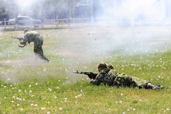 soldiers shoot their weapons during training operation.