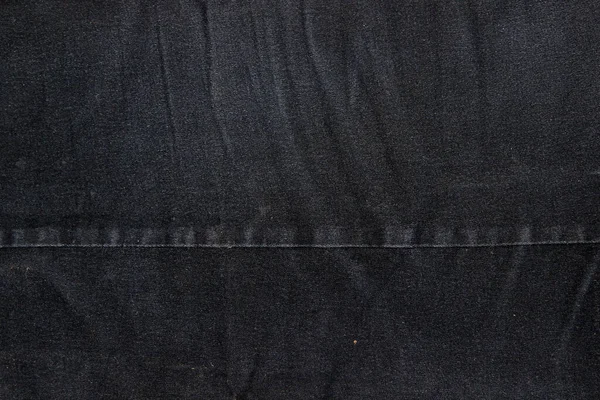 ブラックデニム生地の質感 2枚の布を縫い合わせる — ストック写真