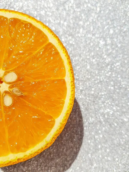 Bright juicy orange on a silver background. Happy Christmas and new year. — Stock Photo, Image