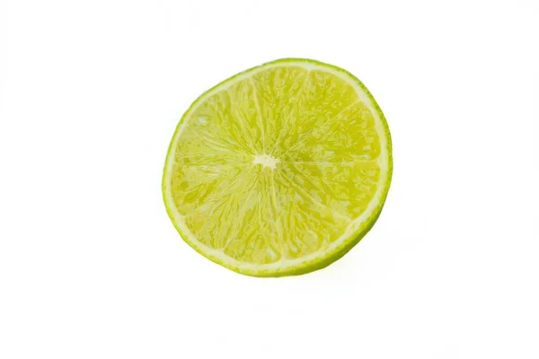 Bright juicy sour lime on a white background cut in half. — Stock Photo, Image