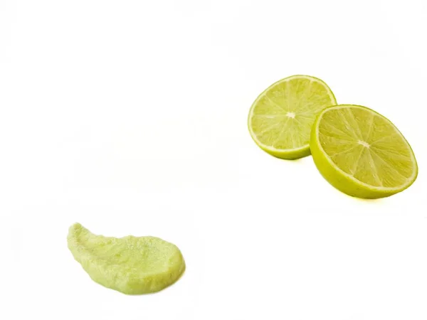 Bright juicy sour lime on a white background cut in half. — Stock Photo, Image