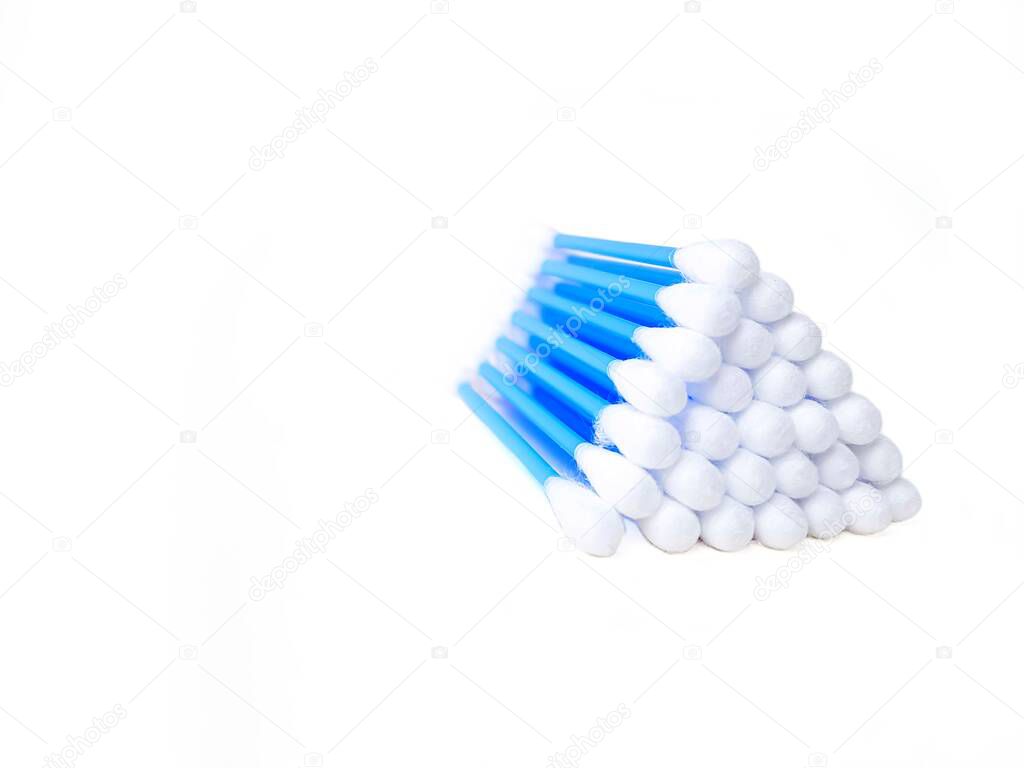Cotton sticks ear blue plastic on a white background. Personal hygiene and care. Cosmetology and medicine.