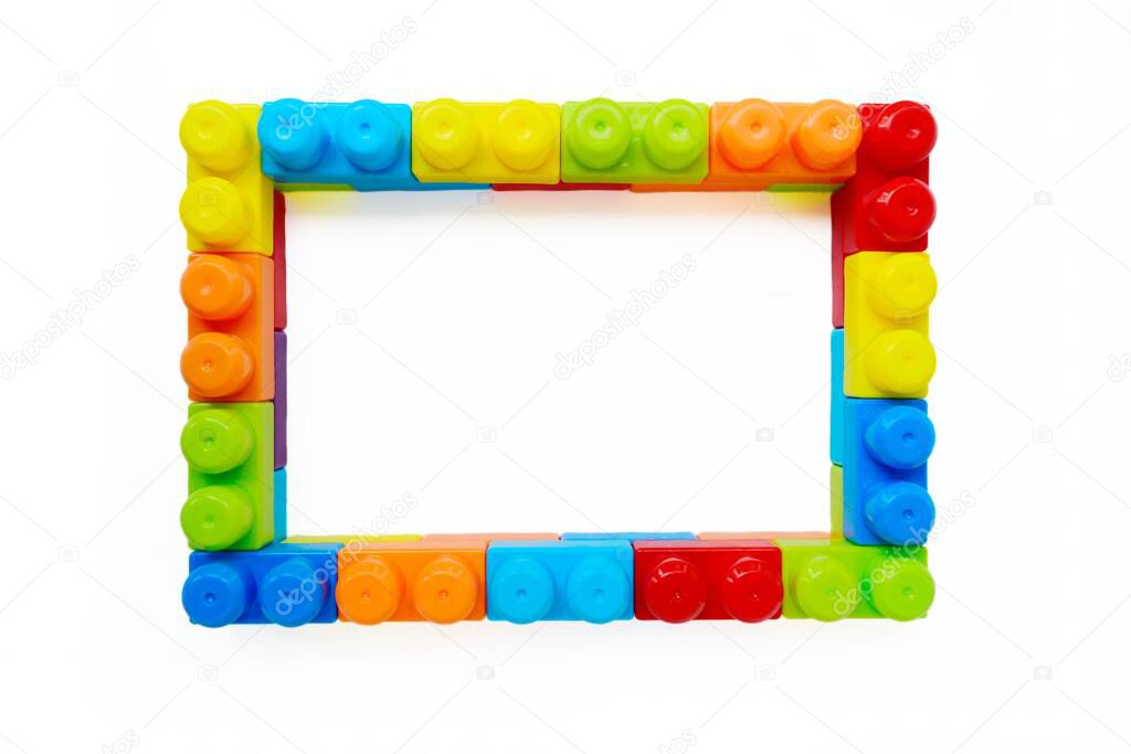 Bright multi-colored childrens designer in the form of a frame on a white background. Interesting educational games for children. A place for your text.
